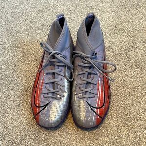 Nike indoor soccer cleats, purple, silver and orange. Youth size 4.5